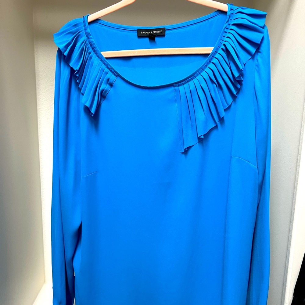 Turquoise blouse, size XL.